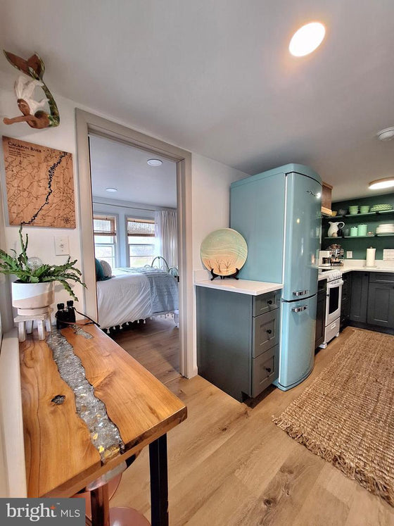 2 BEDROOM COTTAGE ON THE CACAPON RIVER WITH 7 ACRES