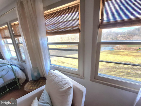 2 BEDROOM COTTAGE ON THE CACAPON RIVER WITH 7 ACRES