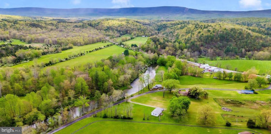 2 BEDROOM COTTAGE ON THE CACAPON RIVER WITH 7 ACRES