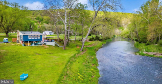 2 BEDROOM COTTAGE ON THE CACAPON RIVER WITH 7 ACRES