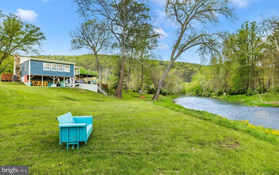 2 BEDROOM COTTAGE ON THE CACAPON RIVER WITH 7 ACRES